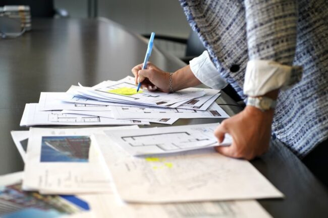 Person reviewing documents planning