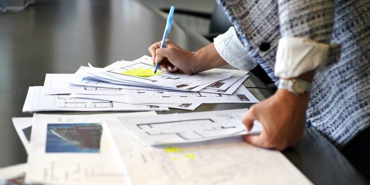 Person reviewing documents planning