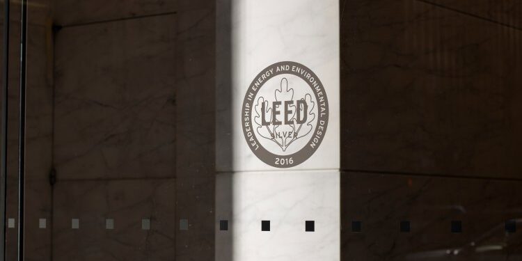 New York, NY, USA – July 2, 2022: LEED Silver certificate icon is seen at the entrance to an office building. LEED (Leadership in Energy and Environmental Design) is a green building rating system. leed